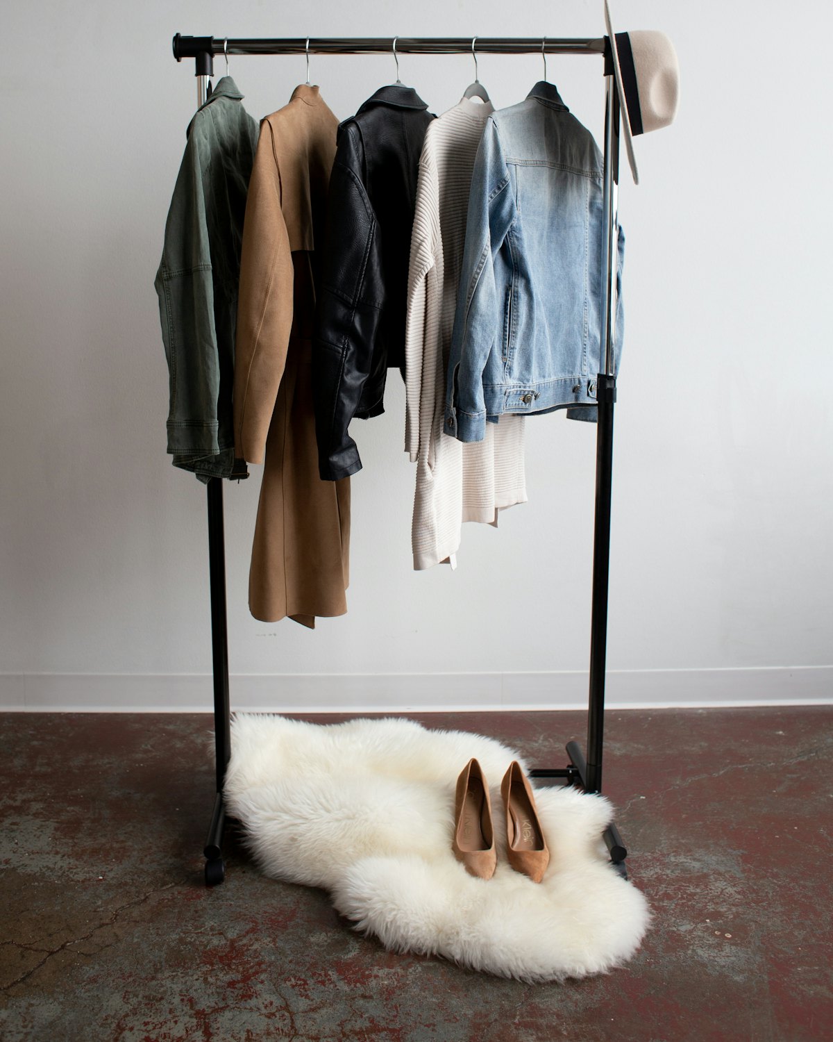 Five jackets hanging on a clothes rail