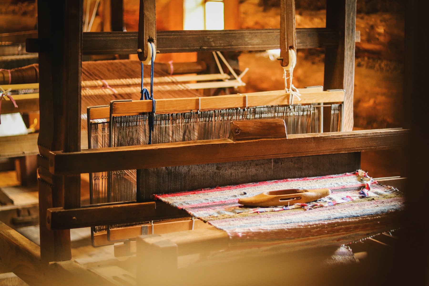 A weaving machine with a length of cloth on it