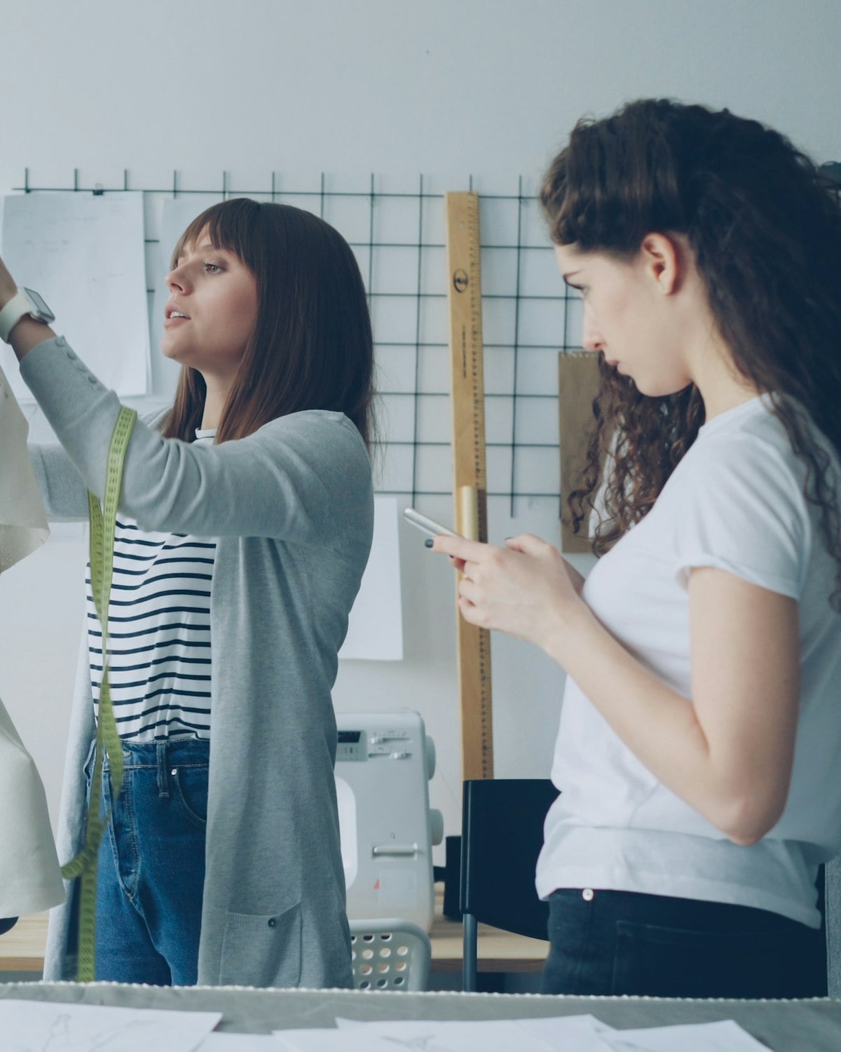 Designers fitting a toile in the atelier